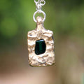 Bronze pendant with emerald necklace